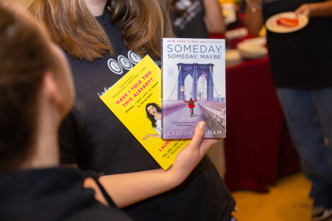 A student holds books by Lauren Graham.