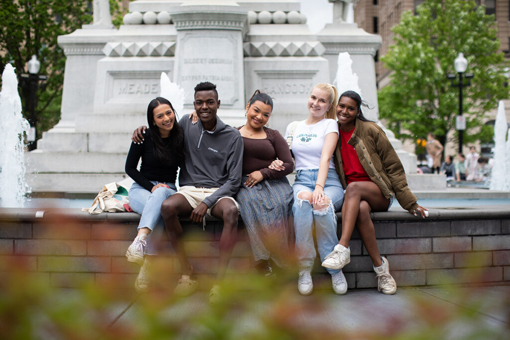 Students sit at the fountain at Centre Square