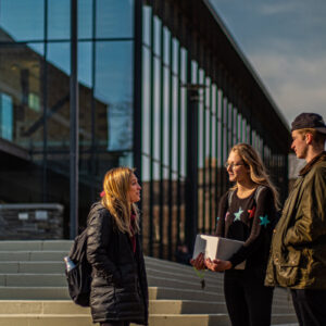 Students chat outside Skillman Library