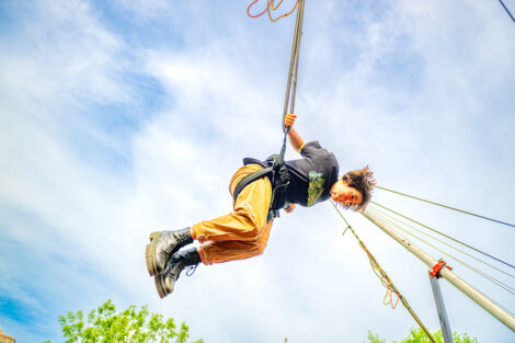 A student bungee jumps