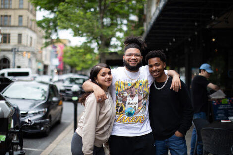 Students smile downtown.