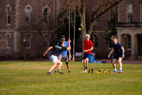 Students play a tennis game on the Quad.