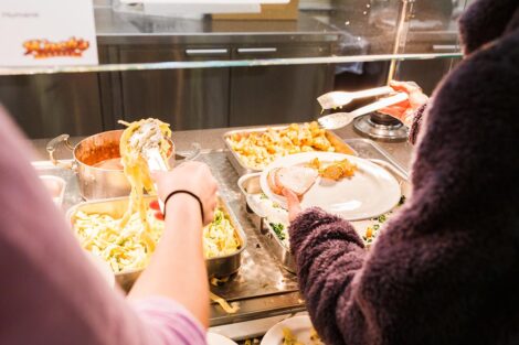 Students select food at a buffet