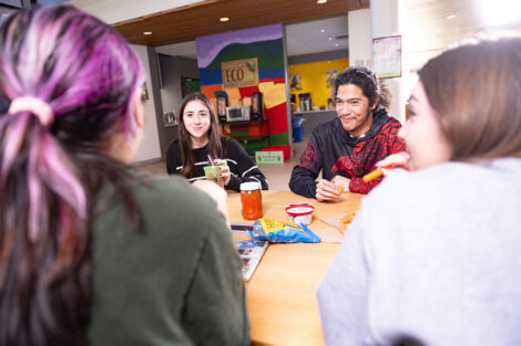 Students interact while eating at Eco cafe.