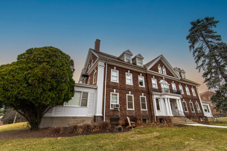 A brick house on campus.