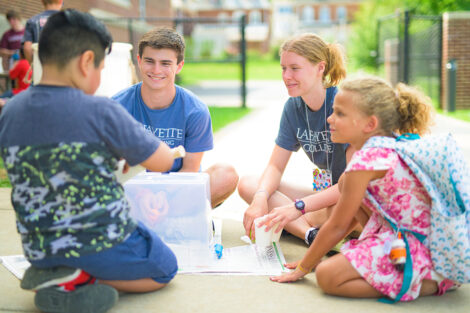 Students interact with children at POSP.