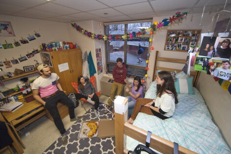 Students in a dorm room.