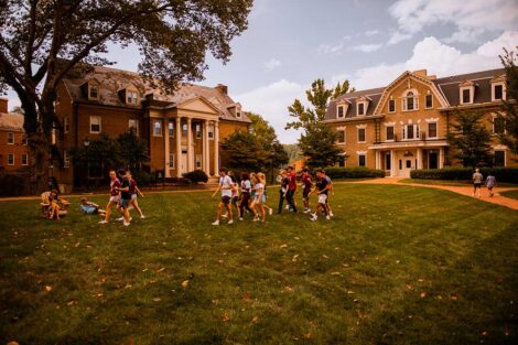 Students walk across a residential area