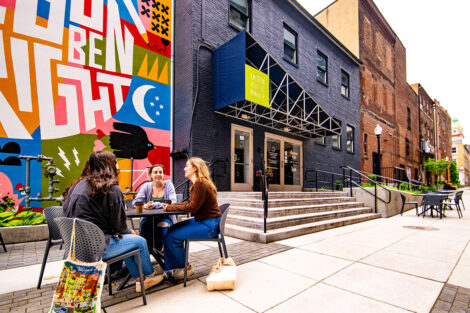Students sit outside of Easton Public Market.